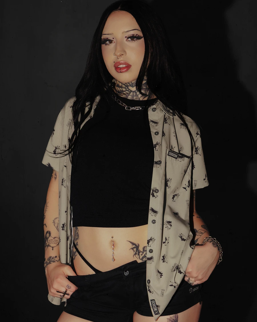 Women's Unhinged Party Shirt worn open over a black top.